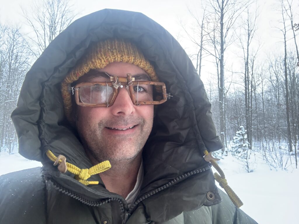 Dub Paetz wearing willow bushcraft glasses made during Alone season 11